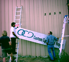 Installing our first sign on Cooks Road