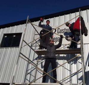Installing sign on new building