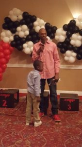 Cedric and his son receiving the Good Samaritan Award